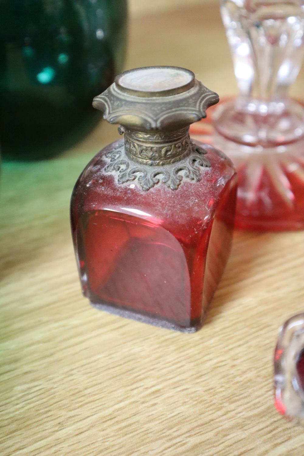 A claret jug with plated mount, Victorian rummer, three Bristol green glass bowls, ruby and cranberry glassware etc.